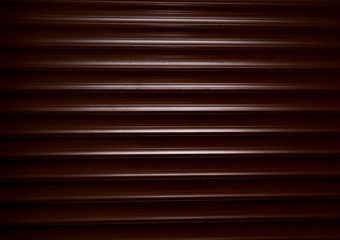 Obraz premium Detailed shot of wooden blinds dramatic light. Background, texture of brown shutter home pattern
