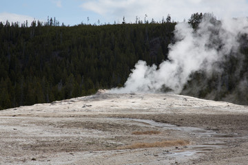Old Faithful before eruption on a mid-May afternoon in Yellowstone National Park, Wyoming.