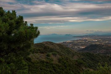 Fototapeta na wymiar Landscape. View of the mountains and the sea from the observation deck of the city of Estepona.