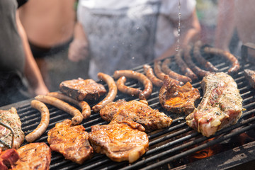 Barbecue, process of cooking meat. Rest on weekends. Friends on picnic