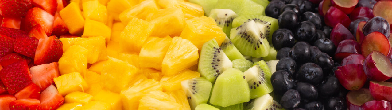 A Background of Rainbow Colored Fruit Salad