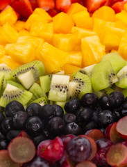 A Background of Rainbow Colored Fruit Salad