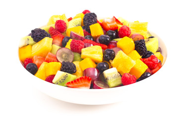 Bowl of Rainbow Colored Fruit Salad Isolated on a White Background