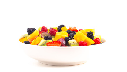 Bowl of Rainbow Colored Fruit Salad Isolated on a White Background