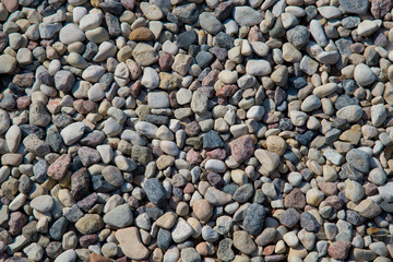 Small sea stones, gravel abstract background. Textures