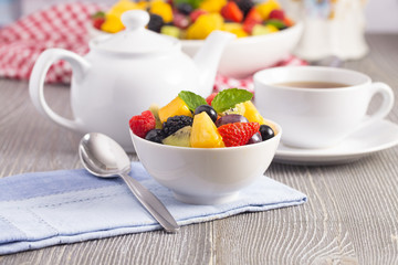 A Table Set for Breakfast with Fresh Fruit Salad