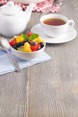 A Table Set for Breakfast with Fresh Fruit Salad