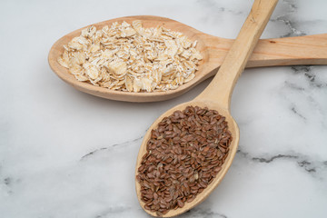 Seeds on a wooden spoon close up