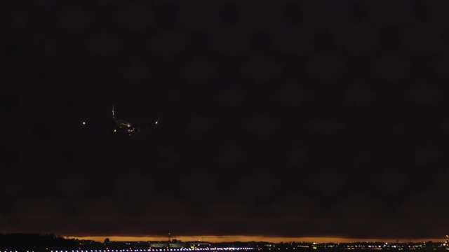 Late evening video of a landing plane at the Warsaw Chopin Airport in Poland.
