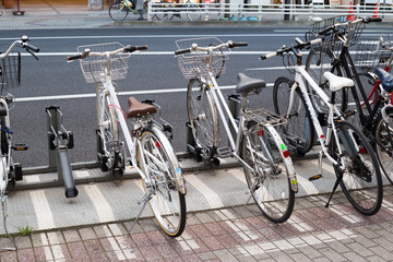 Fototapeta na wymiar Chiba, japan, 04/02/2019 , Bikes parked on the side of the road in Chiba city.