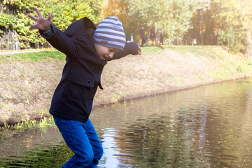 imitation of a jump in the river performed by a child in the fall in the Park