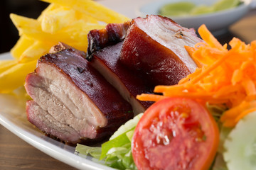 Pork with french fries and salad