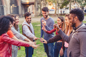 Group of friends counting fingers. Democratic decision concept. Multiracial group of people having fun.