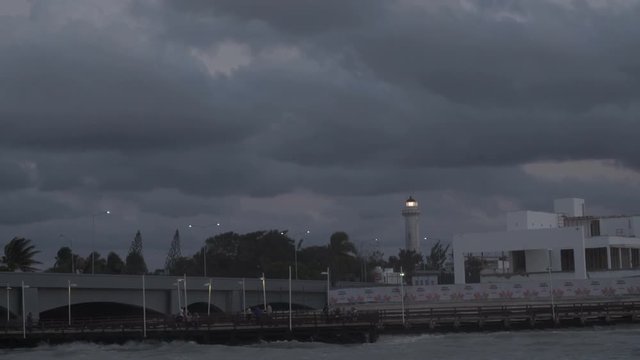 glowing beacon on the background of a stormy sky. 4K
