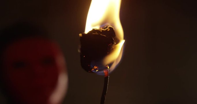 Masked Man Holding a Burning Rose (Slow Motion)
