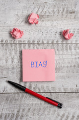 Conceptual hand writing showing Bias. Concept meaning inclination or prejudice for or against one...