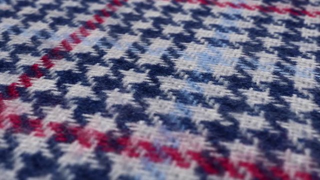 Blue white and red pattern close up shot. Tartan, checked texture waving, Scottish shirt or tablecloth.