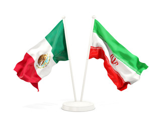 Two waving flags of Mexico and iran isolated on white