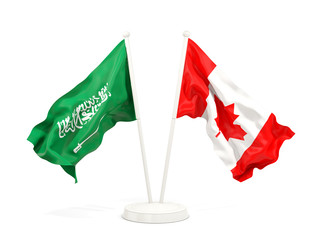 Two waving flags of Saudi Arabia and canada isolated on white