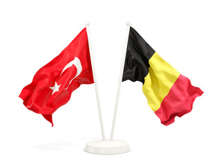 Two waving flags of Turkey and belgium isolated on white