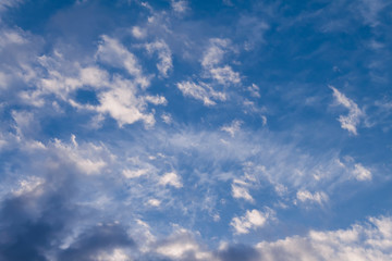 Obraz premium natural photo of a bright blue sky in which white clouds are spread out in an interesting way