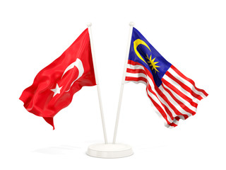 Two waving flags of Turkey and malaysia isolated on white