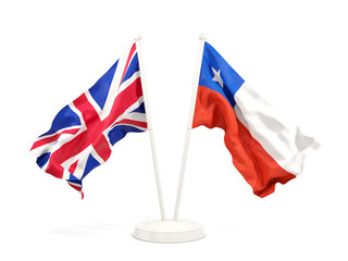Two waving flags of UK and chile isolated on white