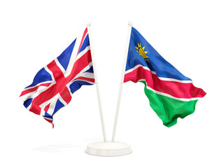 Fototapeta premium Two waving flags of UK and namibia isolated on white
