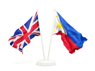 Fototapeta premium Two waving flags of UK and philippines isolated on white