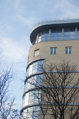 Windows of a high multi-storey residential building. High building. Residential high-rise building.