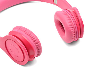 Pink headphones for listening to sound and music on a white background