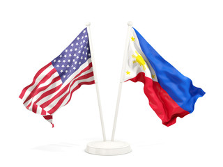 Two waving flags of United States and philippines isolated on white