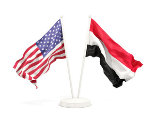 Two waving flags of United States and yemen isolated on white