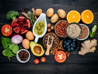 Ingredients for the healthy foods selection. The concept of healthy food set up on wooden background.