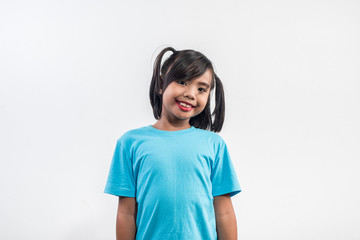 Portrait of Funny little girl acting in studio shot