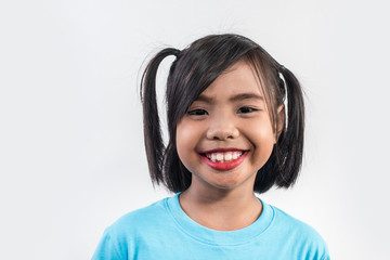 Portrait of Funny little girl acting in studio shot
