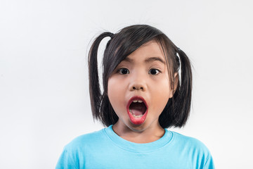 Portrait of Funny little girl acting in studio shot