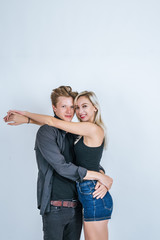 Portrait of happy young couple in studio