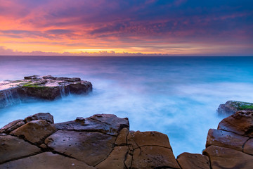 Pretty Shades of a Dawn Seascape with Cascades and Headland