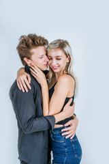 Portrait of happy young couple love together in studio