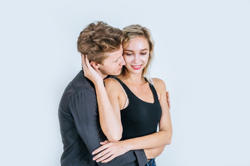 Portrait of happy young couple love together in studio