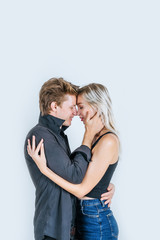 Portrait of happy young couple love together in studio