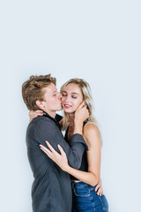 Portrait of happy young couple love together in studio