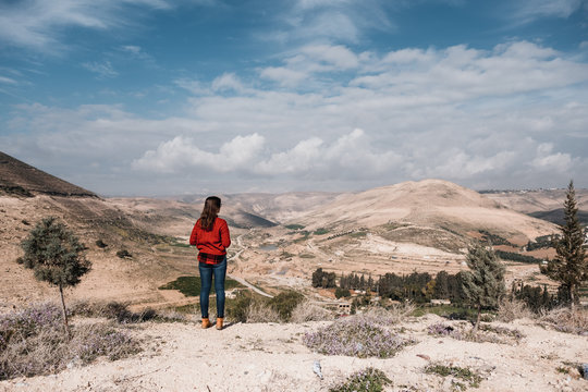 Rear view of unrecognizable woman watching landscape of desert of Jordan, Asia
