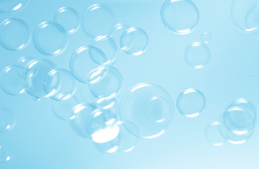 blue bubbles float in the air, abstract background.