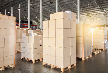 Packaging Boxes Stacked on Pallets in Storage Warehouse. Cardboard Boxes Supply Chain. Storehouse Commerce Shipment Distribution. Shipping Warehouse Logistics.	