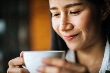 Portrait asian woman smiling relax in coffee shop cafe