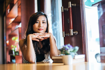 Portrait asian woman smiling relax in coffee shop cafe