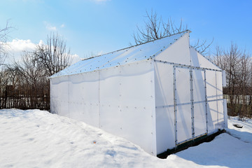 view of the greenhouse of dairy polycarbonate in the snow