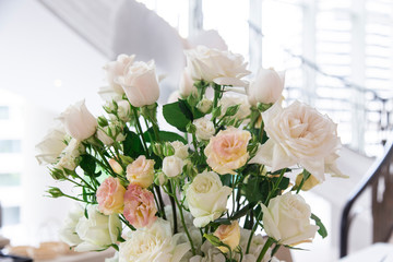 Bouquet flower in the vase on the table.